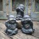 Bronze Buddhist monk figures in see, hear, speak no evil pose